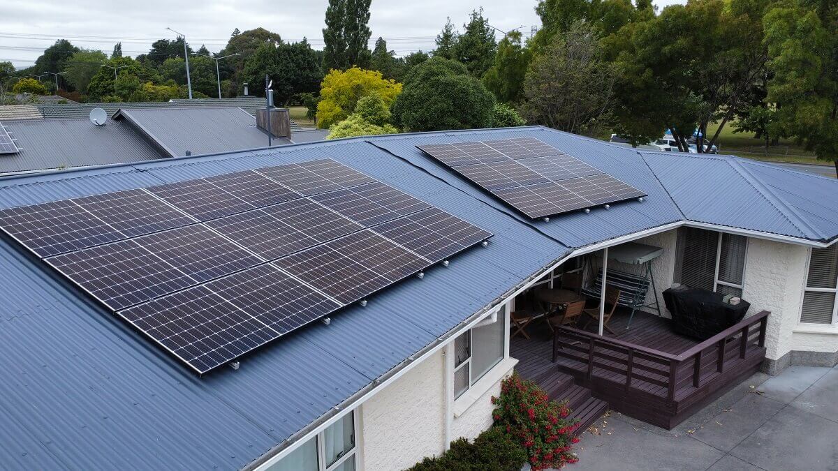 Grid-tied solar panels across two roof sections on a Canterbury home