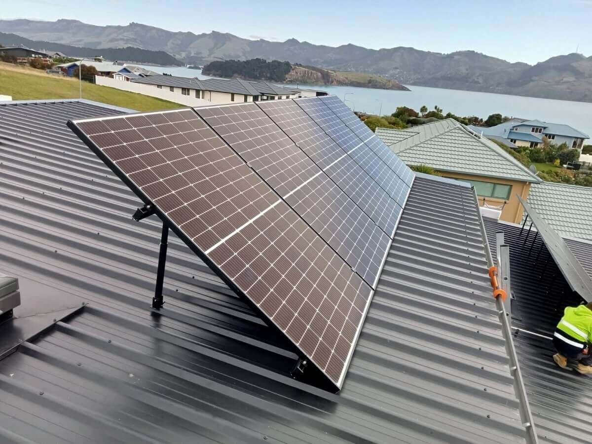 Detailed view of solar panel mounting on a metal roof